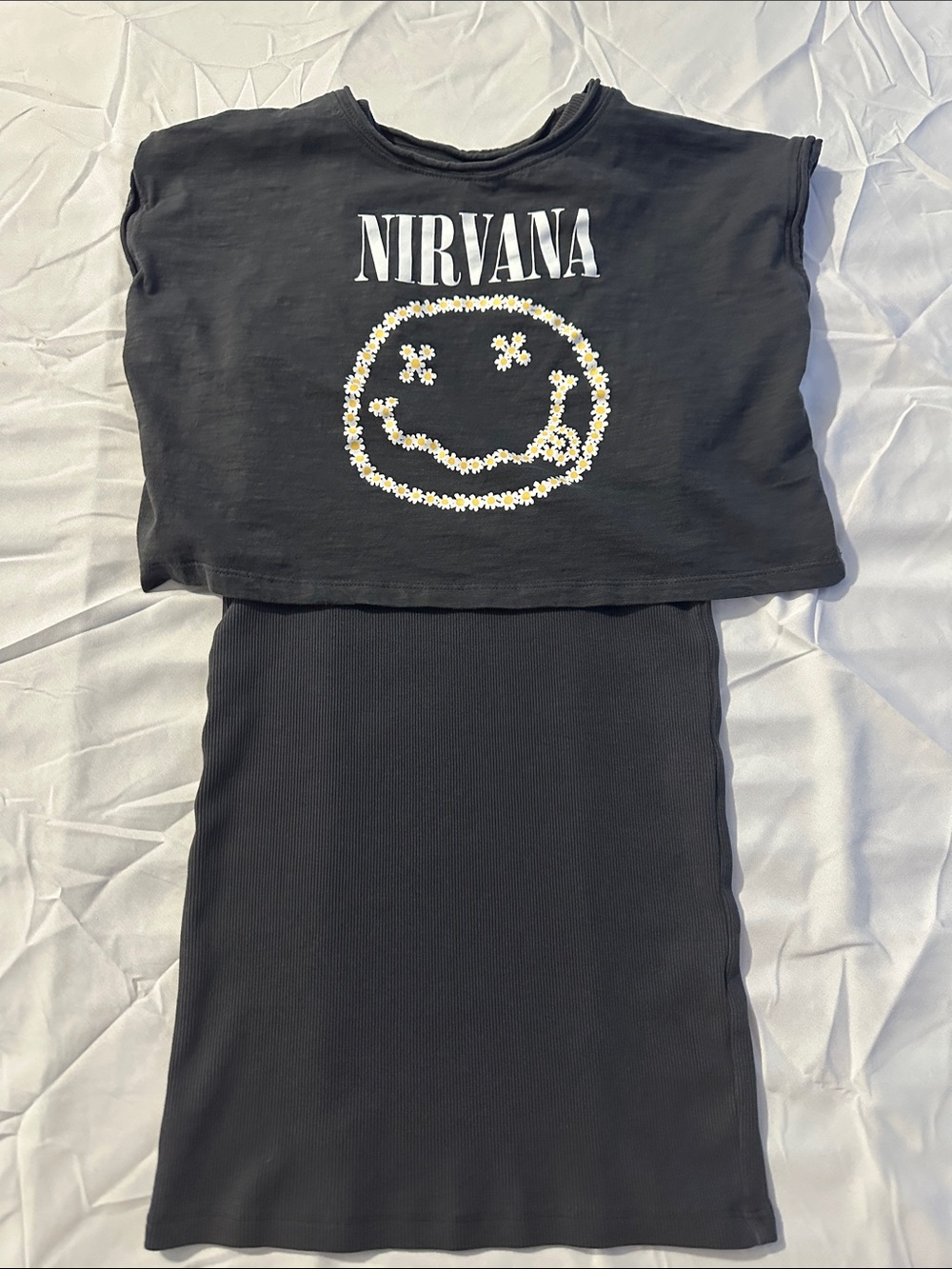 NIRVANA charcoal gray Cropped Tee with Daisy Smile Graphic over a tank dress